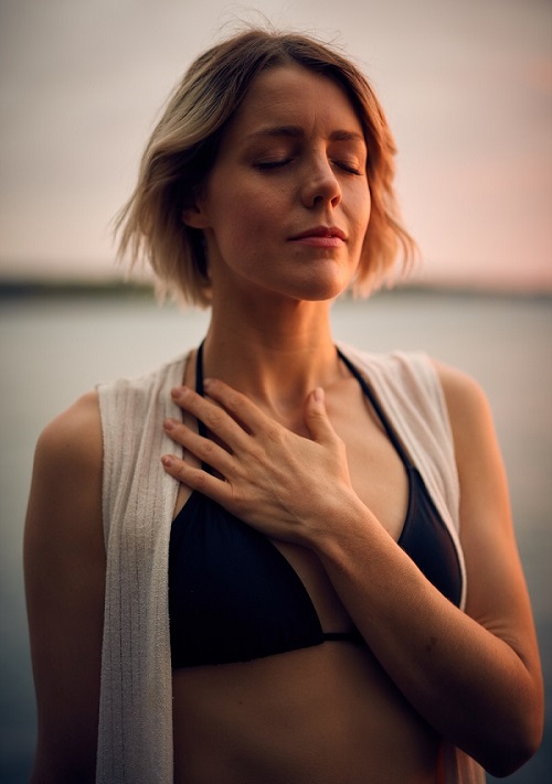 Woman with self-love by the water