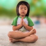 Small girl meditating