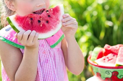 A girl eating watermelon