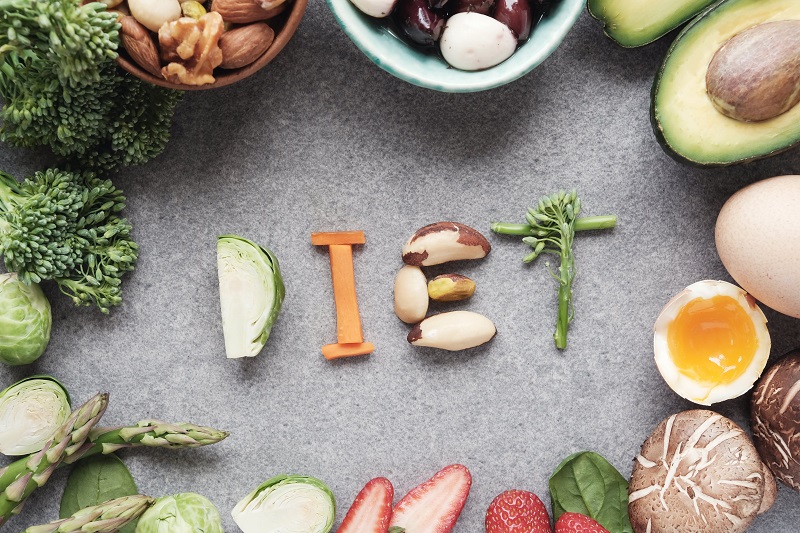 The word diet written with healthy foods