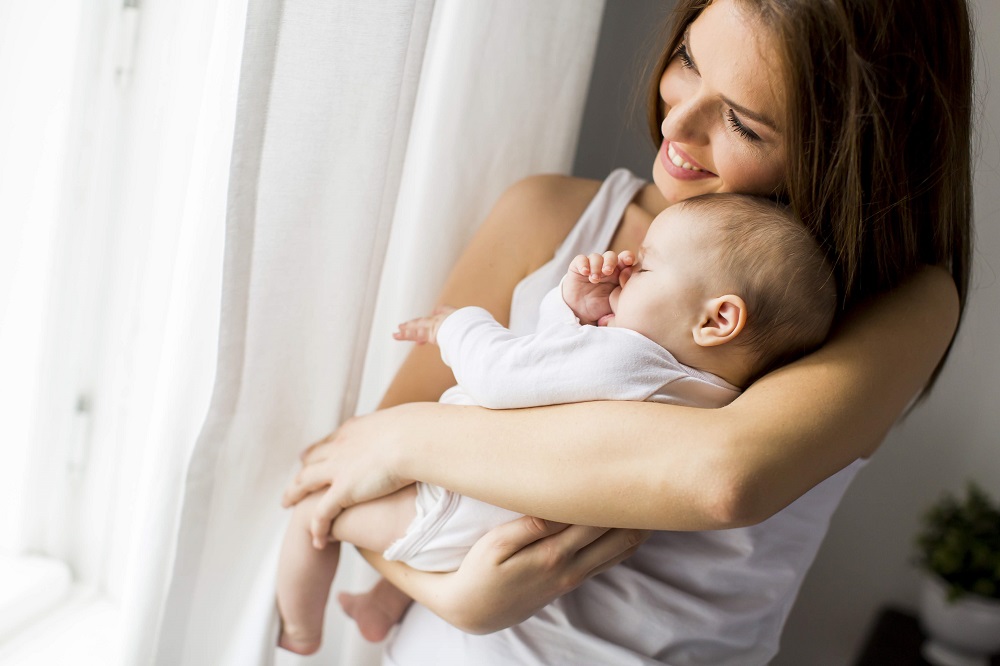 Mother holding new born baby