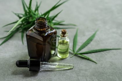 CBD oil and cannabis leaves