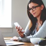 woman looking at screens with blue light