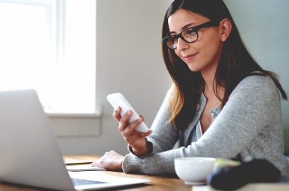 woman looking at screens with blue light