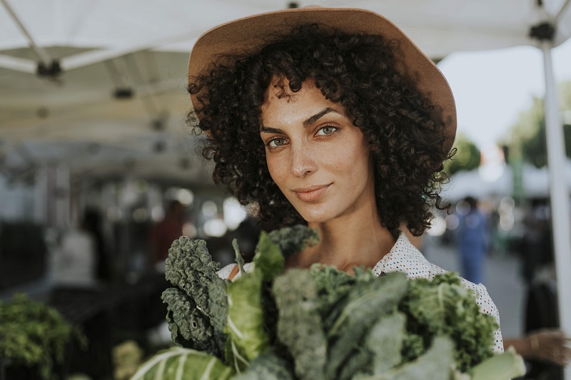 Woman buying kale